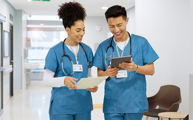 Medical residents walking through hospital hallway