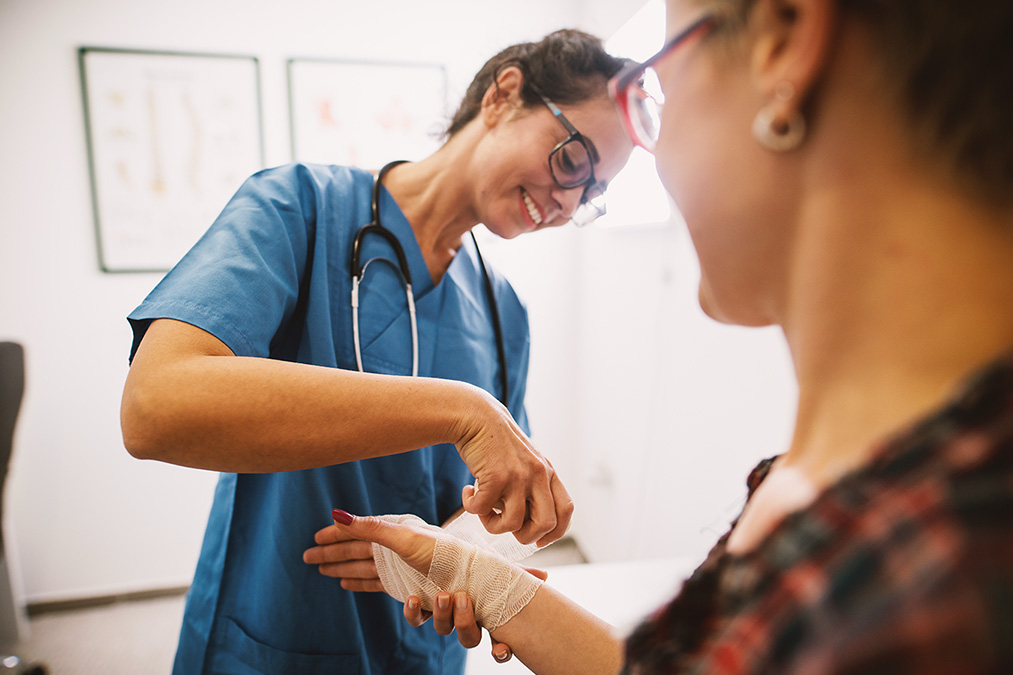 Urgent care provider helping patient